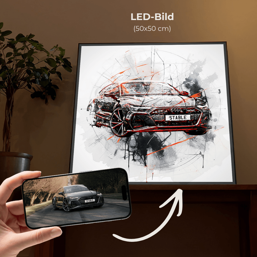 Gerahmtes Auto-Wandbild im Wohnzimmer: schwarzer Sportwagen mit roten Akzenten und Farb-Sprenkeln