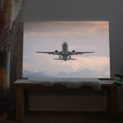 LED-Bild mit startendem Flugzeug im Flug, im Rahmen