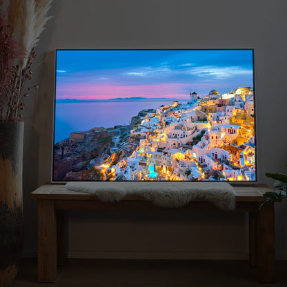 LED-Bild „Santorini bei Nacht“ mit warm beleuchtetem Küstenort, rechteckiger Rahmen