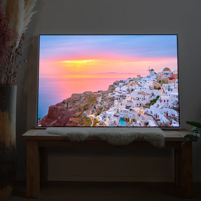 LED-Bild mit schwarzem Rahmen, Sonnenuntergang über weißem Santorini-Ort am Meer