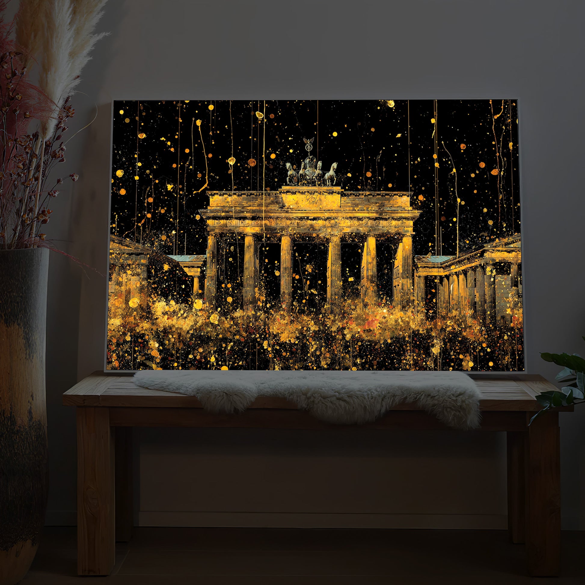 LED-Bild mit goldenem Brandenburger Tor-Motiv und leuchtenden Lichterfunken