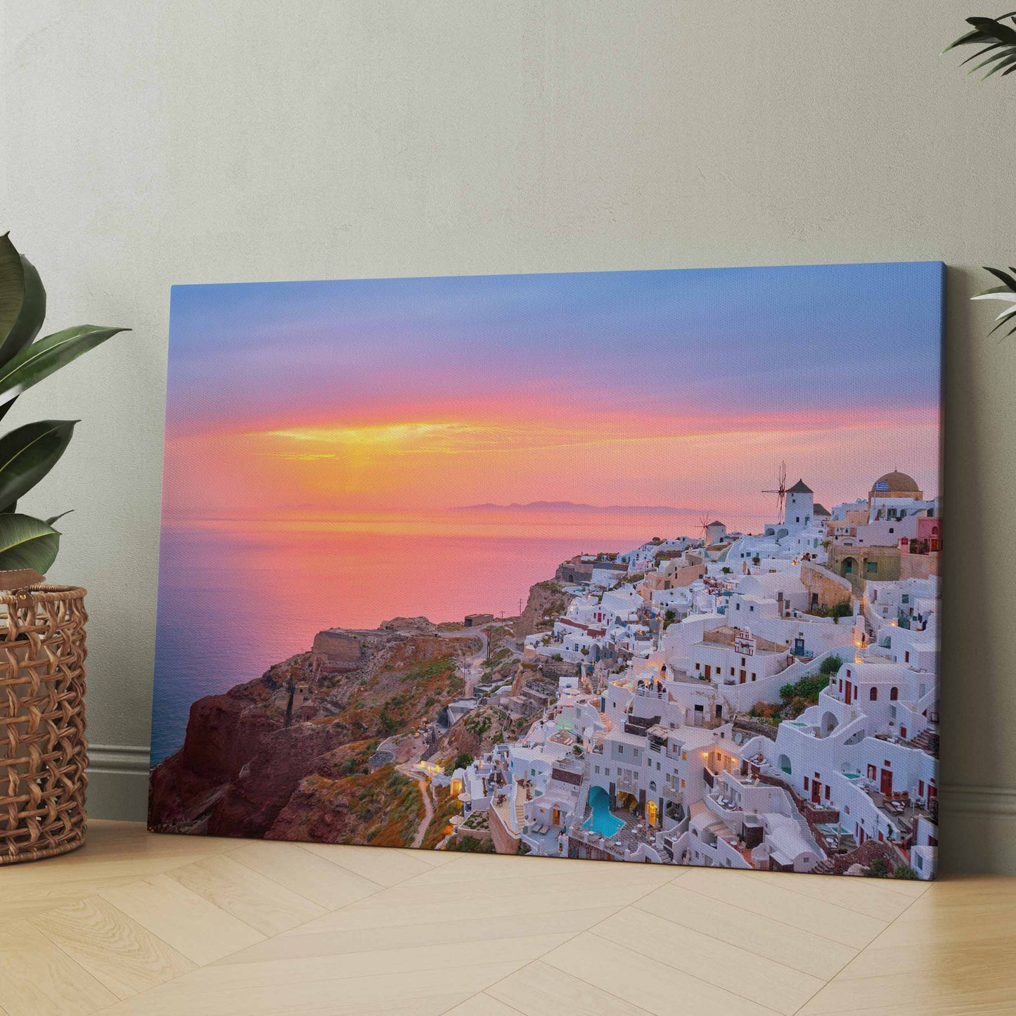 Leinwandbild mit Sonnenuntergang über weißem Küstenort